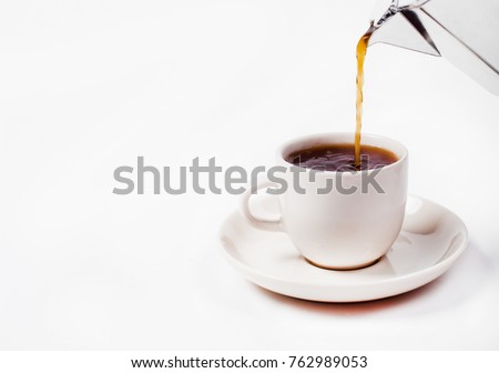 Moka pot and pouring coffee. close-up  drip coffee isolated on white background. Royalty-Free Stock Photo #762989053