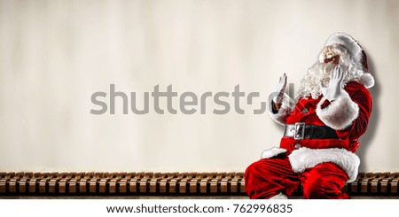 Santa claus and wall background of free space for your text or logo. 