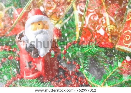 Christmas toy Santa Claus surrounded by fir branches