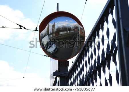 convex spherical road mirror.
