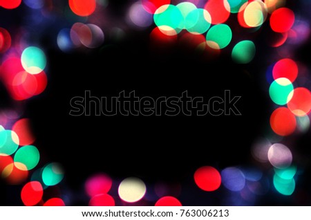  Golden holiday abstract  defocused background. Bokeh  frame on black background. Abstract glitter border or frame