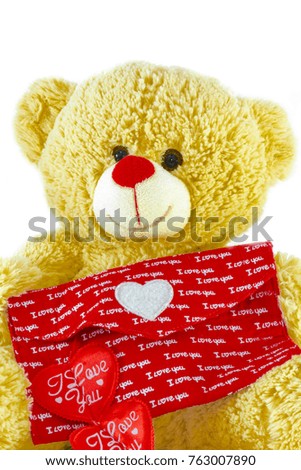 Teddy Bear Holding a Heart on white background.