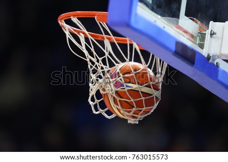Basketball ball, board and net on black background 