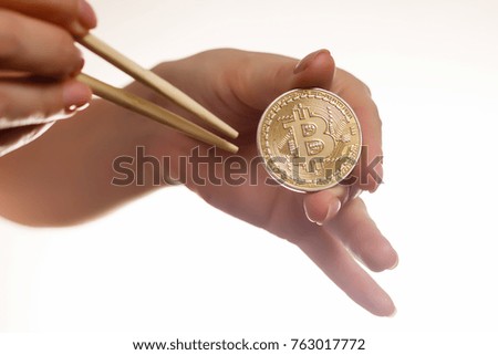 Isolated of hand putting a bitcoin concept human hand with bitcoin hand with bitcoin