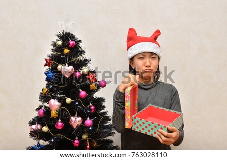 Girl and Christmas present