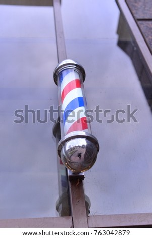 Barber Shop Pole. Symbol of a barbershop Lamp