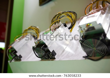 Cryptocurrency mining equipment - ASIC - application specific integrated circuit on farm stand