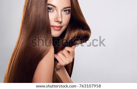 Beautiful model girl with shiny brown and straight long  hair . Keratin  straightening . Treatment, care and spa procedures. Smooth hairstyle
 Royalty-Free Stock Photo #763107958