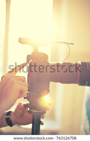 Camera in yellow sparkle sun highlights hand touch
