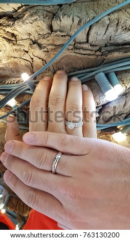 picture of man and woman with engagement rings