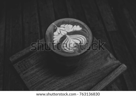 Close up  coffee cup on the wooden board, selective low key tone