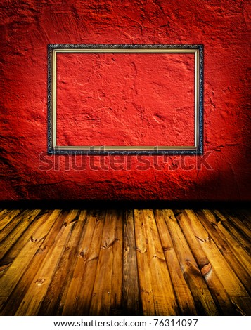 vintage red terracotta interior with empty classic frame hanging on the wall concept dissonance