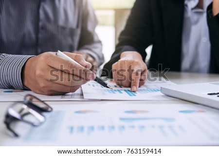 Co working conference, Business team meeting present, investor colleagues discussing new plan financial graph data on office table with laptop and digital tablet, Finance, accounting, investment. Royalty-Free Stock Photo #763159414