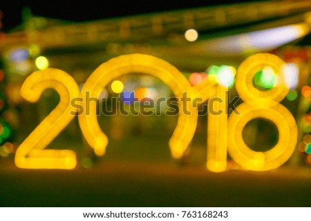 blur Happy New Year 2018 from gold lighting bokeh 