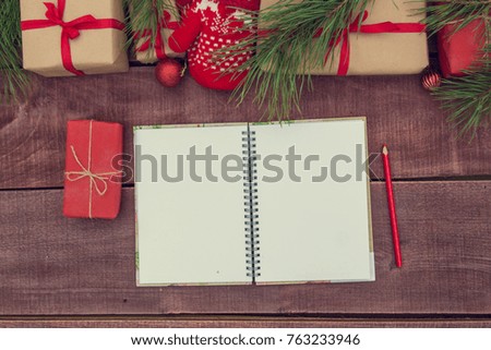 Christmas gifts lay on the old wooden background