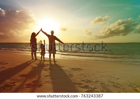 happy family with kids play at sunset beach