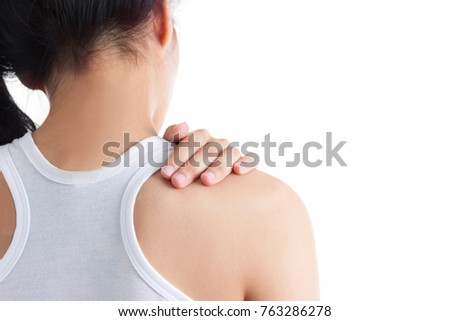 Portrait of a young brunette girl back pain.