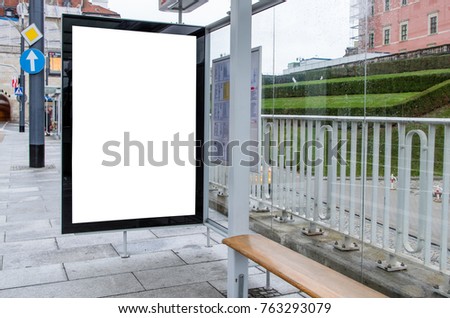 Empty advertising banner on the glass bus stop, isolated clipping path object