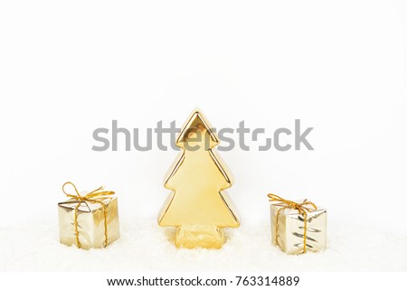 Christmas background with gold christmas tree and gifts on glitter. Holiday background. Merry christmas.