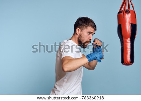 fight, a man hits the punching bag, sports                               