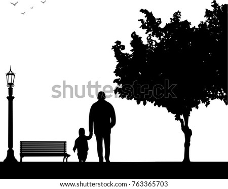 Grandfather walking with his grandson in the park