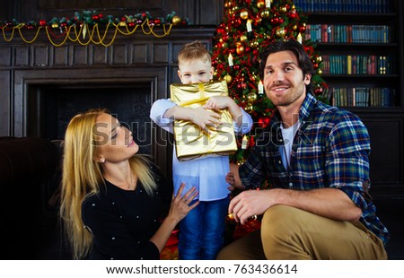 Family home portrait. Parents and son spending time together