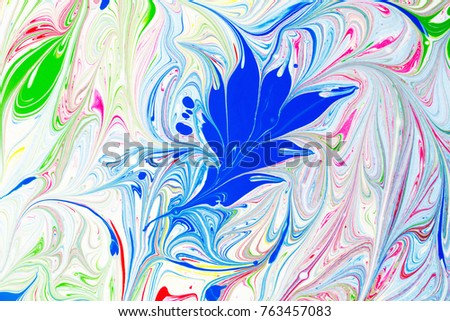 Abstract pattern, Traditional Ebru art. Painting on water, followed by paper prints. Color ink paint with waves. Floral background.