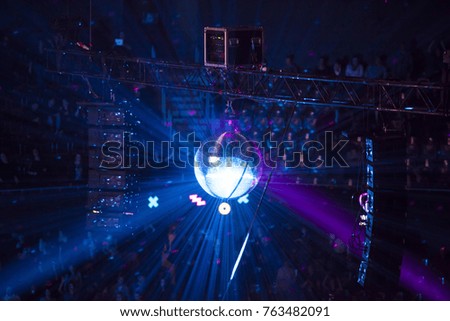 Disco ball with bright rays - night party concept