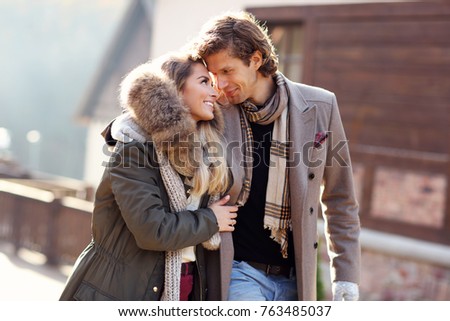 Picture showing happy couple walking outdoors in winter