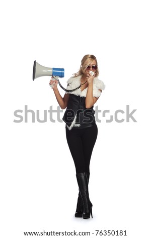 Young blonde woman  shouting through  megaphone