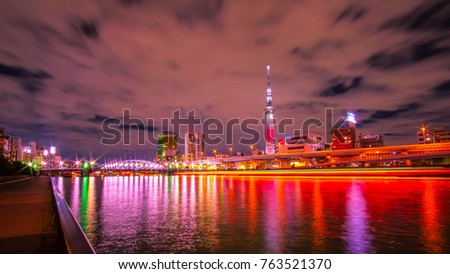 Cityscape with Skytree and Lights Reflected in the Sumida River at Blue Hour, Tokyo, Japan