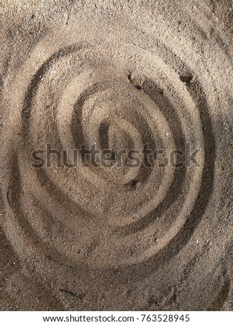 Draw a circle on the sand