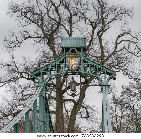 Bridge and tree in winter Royalty-Free Stock Photo #763536298