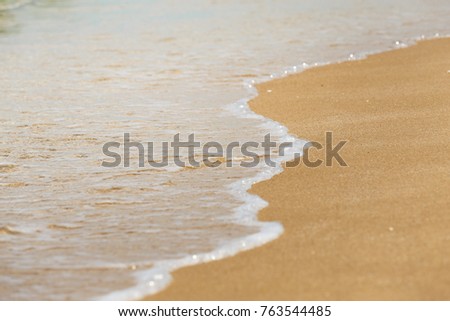 Soft beautiful ocean wave on sandy beach. Wave of the sea on the sand beach. use for summer or background concept.