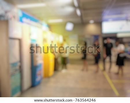 blurred image for background abstract of people line up to use Banking Machine or ATM(Automatic Teller Machine) to Deposit in city