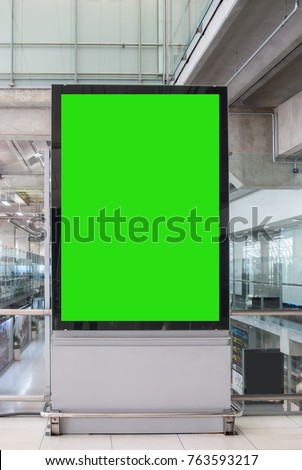 Blank billboard advertising panel in terminal airport, Mock up green screen, insert for text of customer. Space for texting in products or promotional at airport,train station,advertising public