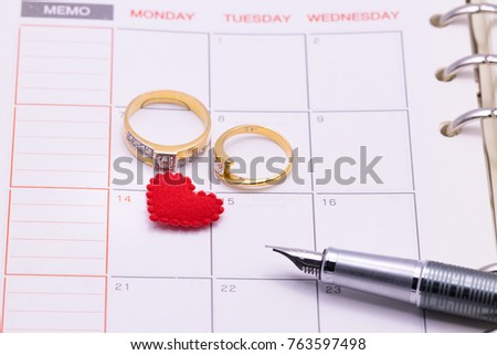 Diary note with  wedding rings and quill pen (Organizer ,agenda, book, diary)