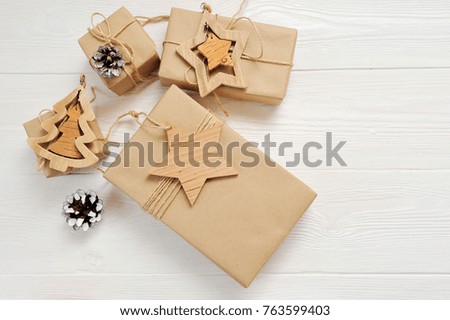 Mockup Christmas boxes gift with tag and place for your text on a white wooden background. Flat lay, top view photo mock up