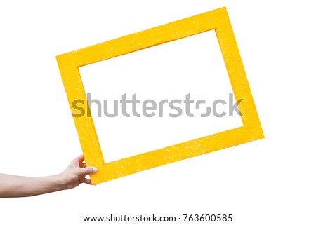 Yellow frame on hand isolated on white background