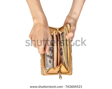 Woman's hands removing money out of purse. isolated on white.