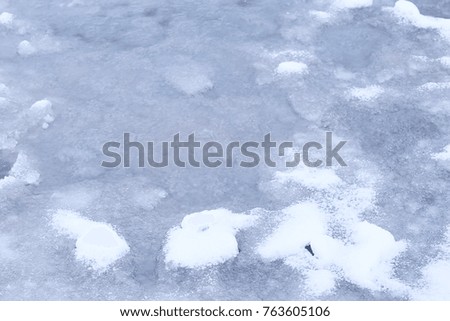abstract winter background / gray ice with snow, background for text. abstract background cold with snowfall.