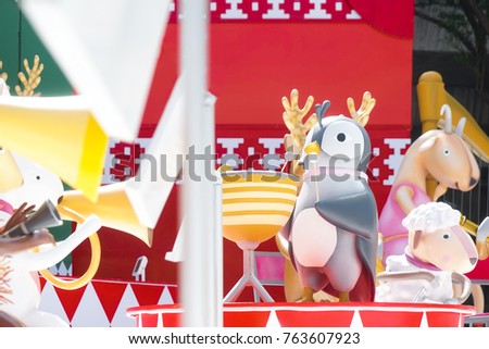 Christmas decorations. Animal musical band selective focus on penguin conductor, Christmas chorus concept.