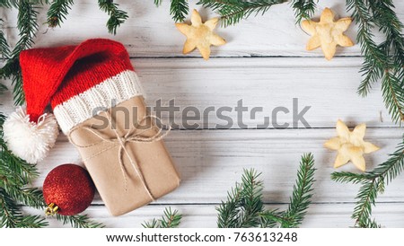 Christmas gift box. wooden white background with tree branches and copy space
