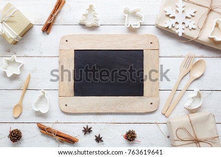 Above view aerial image of food cooking items & decoration merry Christmas and Happy new year background concept.Free space on blackboard for creative design text.Objects on modern rustic white wooden