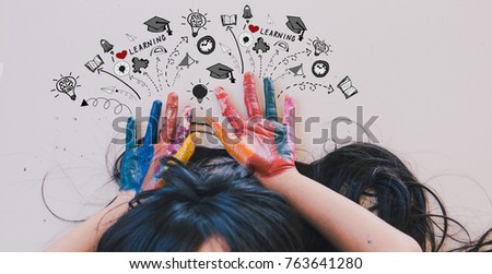 I love learning , art and creativity concept - A black long hair asian student put her colourful hands painting up