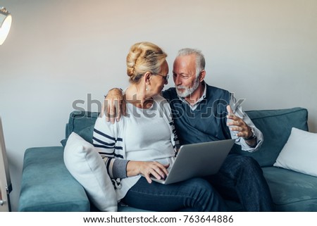 Elderly couple using a computer