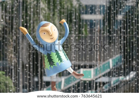 Christmas decorations. Little boy wearing Christmas outfit standing on one leg with abstract blur background.