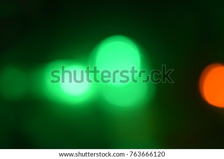 green lights on a black background