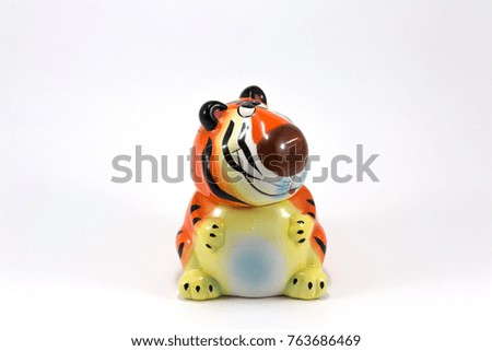toy tiger from ceramics isolated on white background