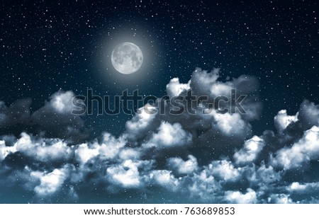 Beautiful magic blue night sky with clouds and fullmoon and stars closeup